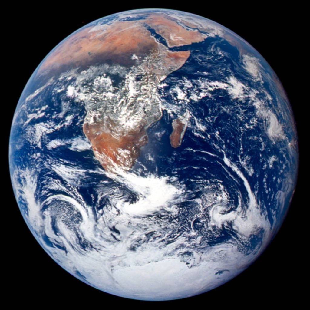 Earth photographed by the Apollo 17 crew, showing Africa, Antarctica and swirling clouds.