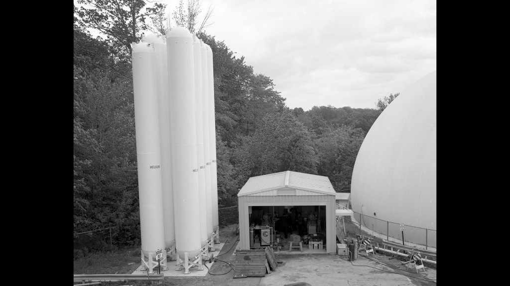 Historical NASA photograph of cylindrical helium tanks at the Rocket Engine Test Facility.